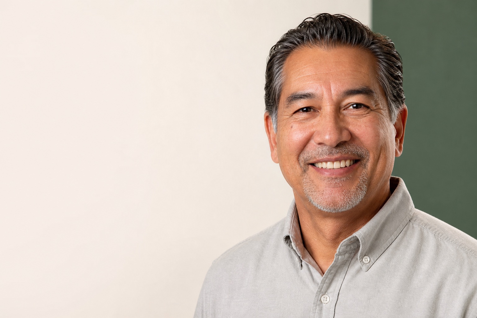 Adult smiling while exploring missing-tooth options